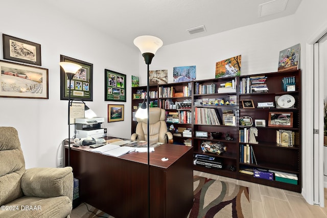 office space with light hardwood / wood-style floors