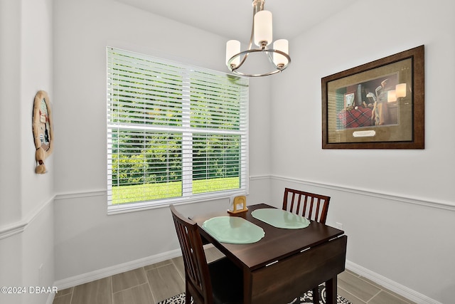 dining space featuring a notable chandelier