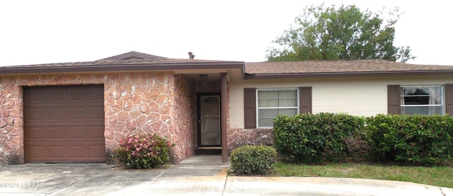 single story home featuring a garage