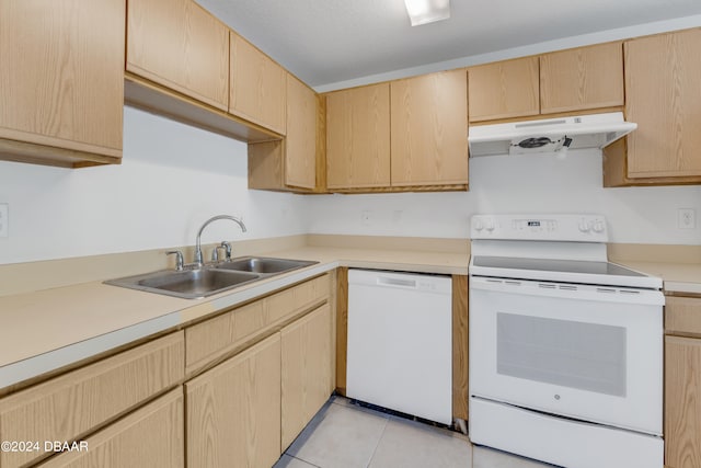 kitchen with light brown cabinets, white appliances, sink, and light tile patterned flooring