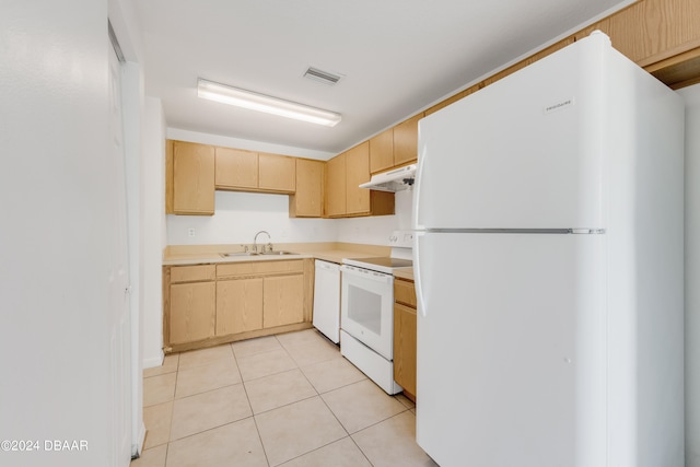 kitchen with light brown cabinets, white appliances, sink, and light tile patterned floors