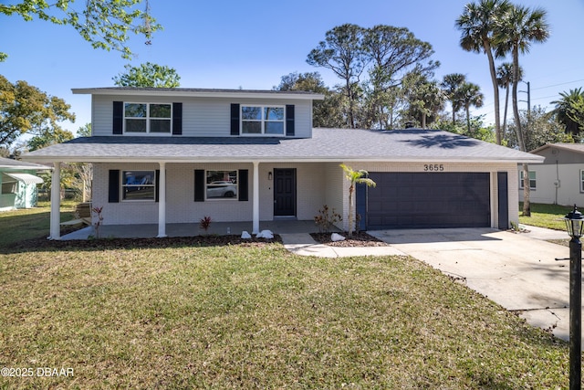 traditional-style house with brick siding, a front lawn, covered porch, driveway, and an attached garage