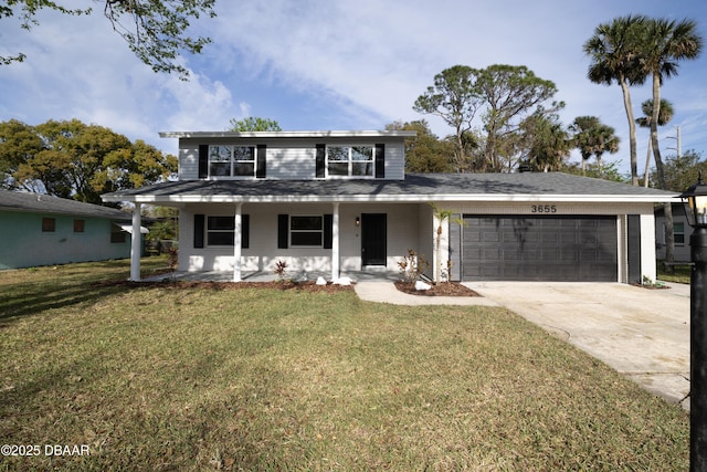 traditional-style home with a garage, driveway, covered porch, and a front yard