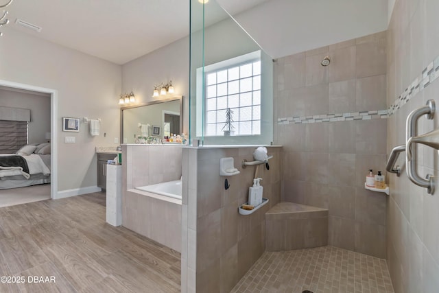 bathroom featuring vanity, separate shower and tub, and wood-type flooring