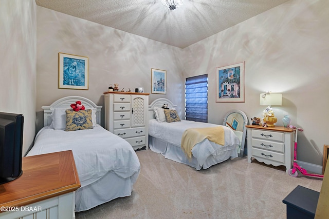 carpeted bedroom featuring a textured ceiling