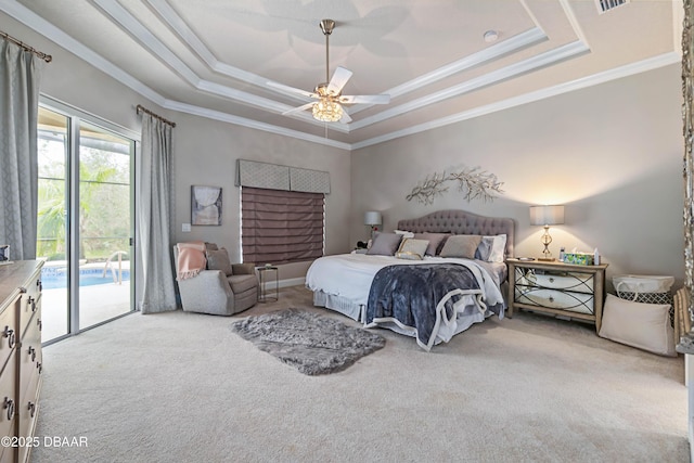 carpeted bedroom featuring crown molding, ceiling fan, a tray ceiling, and access to exterior