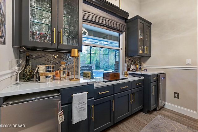 bar featuring decorative backsplash and wood-type flooring