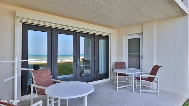 5499 S Atlantic Ave Unit 104, New Smyrna Beach, FL 32169 - view of patio with french doors