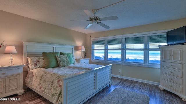 5499 S Atlantic Ave Unit 104, New Smyrna Beach, FL 32169 - bedroom with wood finished floors, baseboards, and ceiling fan