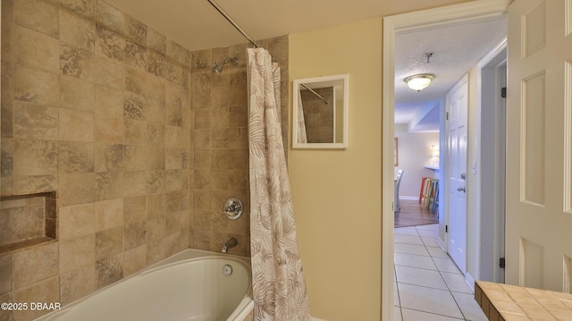 5499 S Atlantic Ave Unit 104, New Smyrna Beach, FL 32169 - full bathroom featuring tile patterned flooring and shower / bath combo with shower curtain