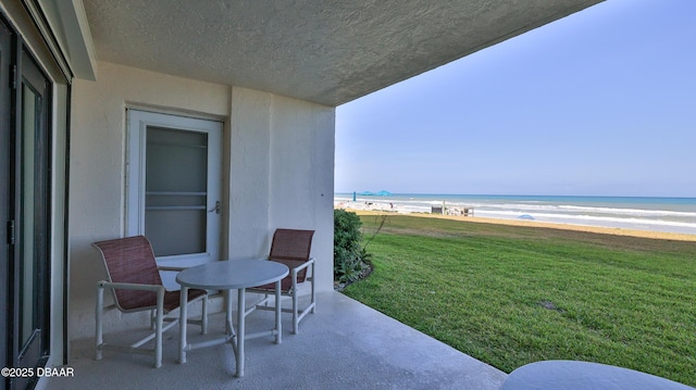 5499 S Atlantic Ave Unit 104, New Smyrna Beach, FL 32169 - balcony featuring a water view and a beach view