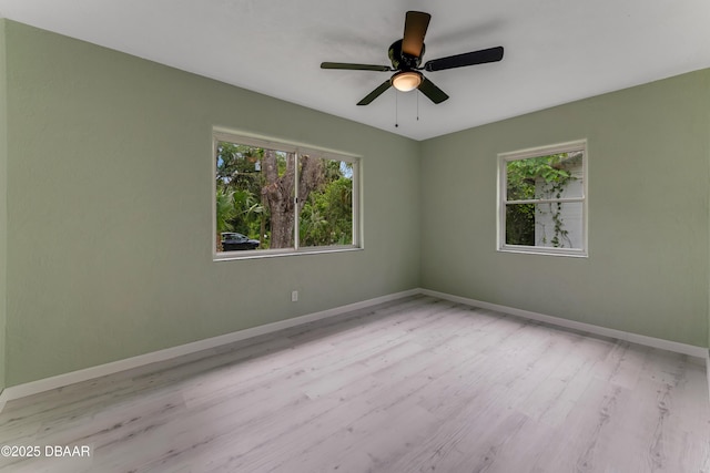 182 Grove St, Ormond Beach, FL 32174 - empty room with wood finished floors, baseboards, and a ceiling fan