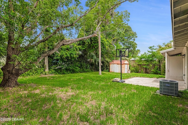 182 Grove St, Ormond Beach, FL 32174 - view of grassy yard with central AC unit and a patio
