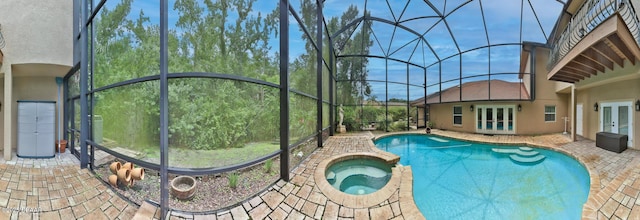 1929 Spruce Creek Lndg, Port Orange, FL 32128 - view of swimming pool with french doors, a patio area, a lanai, and a pool with connected hot tub