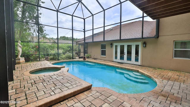 1929 Spruce Creek Lndg, Port Orange, FL 32128 - view of pool with french doors, a patio area, glass enclosure, and a pool with connected hot tub