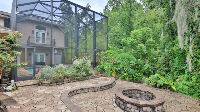 1929 Spruce Creek Lndg, Port Orange, FL 32128 - patio / terrace featuring french doors, an outdoor fire pit, a patio area, and an outdoor pool