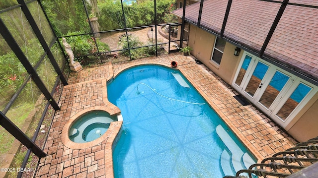 1929 Spruce Creek Lndg, Port Orange, FL 32128 - view of pool featuring a patio, a lanai, french doors, and a pool with connected hot tub