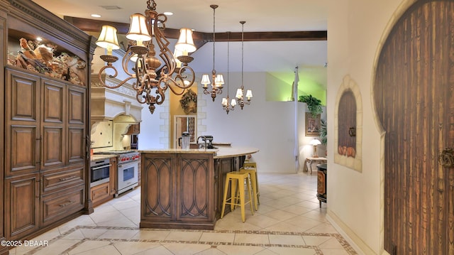 1929 Spruce Creek Lndg, Port Orange, FL 32128 - kitchen featuring high end stainless steel range oven, inlaid floor details, light tile patterned floors, a chandelier, and recessed lighting
