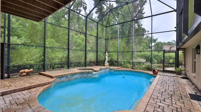 1929 Spruce Creek Lndg, Port Orange, FL 32128 - view of pool featuring glass enclosure, a patio area, and a pool with connected hot tub