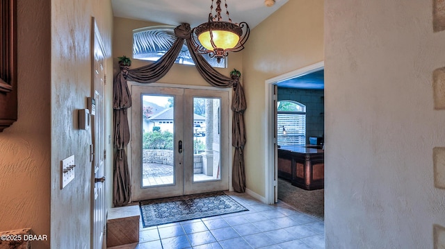 1929 Spruce Creek Lndg, Port Orange, FL 32128 - entrance foyer featuring french doors, light tile patterned floors, and vaulted ceiling