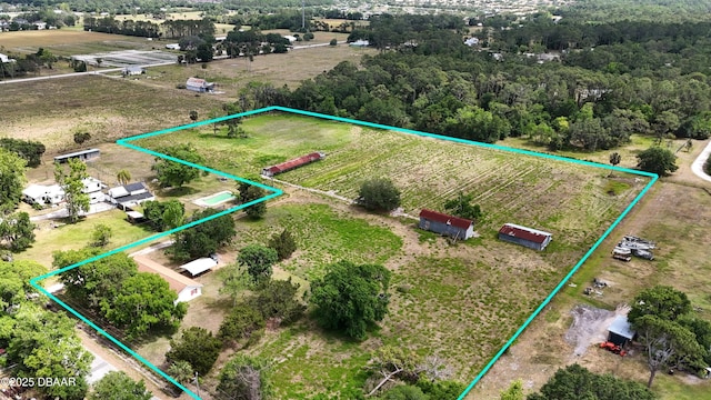 birds eye view of property featuring a rural view