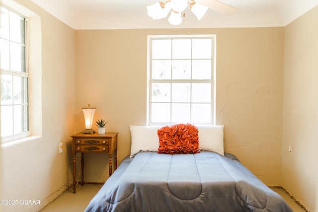 bedroom with multiple windows
