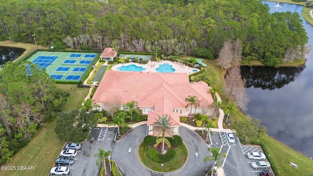 birds eye view of property with a water view