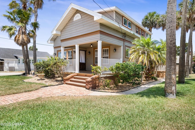 view of front of property featuring a porch and a front lawn