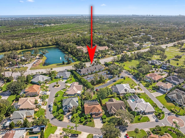 birds eye view of property featuring a water view