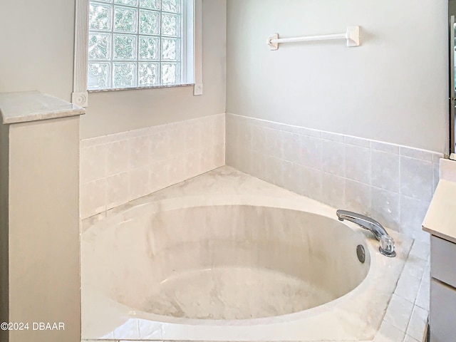 46 Coquina Point Dr, Ormond Beach, FL 32174 - bathroom with vanity and tiled tub
