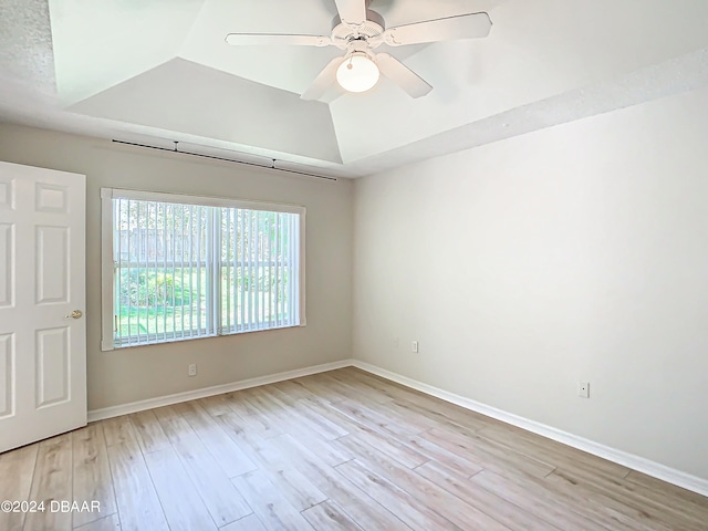 46 Coquina Point Dr, Ormond Beach, FL 32174 - unfurnished room featuring light hardwood / wood-style floors, ceiling fan, and a tray ceiling