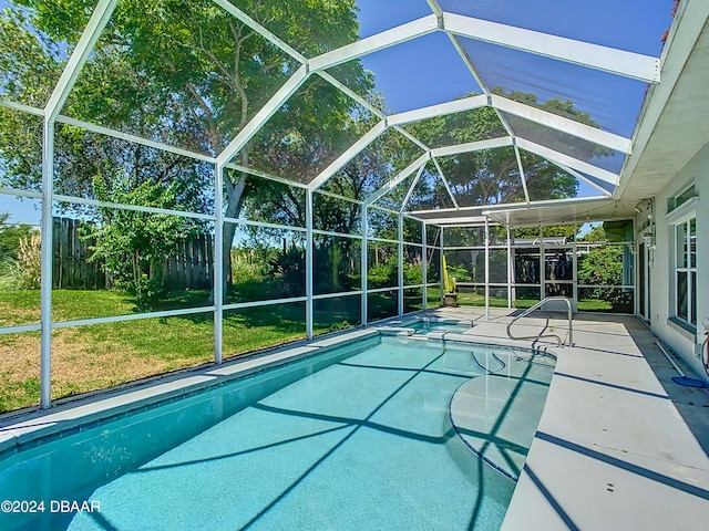 46 Coquina Point Dr, Ormond Beach, FL 32174 - view of swimming pool featuring a lanai, a yard, and a patio area