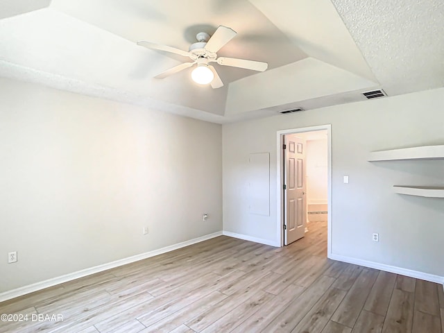 46 Coquina Point Dr, Ormond Beach, FL 32174 - unfurnished room with ceiling fan, light hardwood / wood-style flooring, and a tray ceiling
