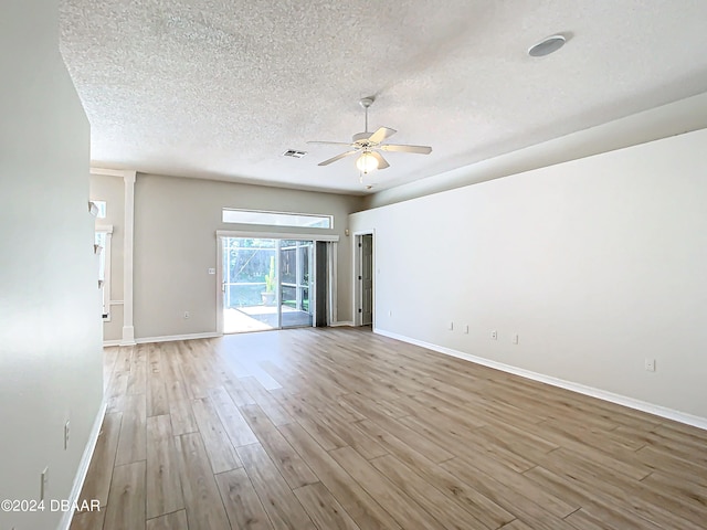 46 Coquina Point Dr, Ormond Beach, FL 32174 - spare room featuring light hardwood / wood-style flooring, a textured ceiling, and ceiling fan
