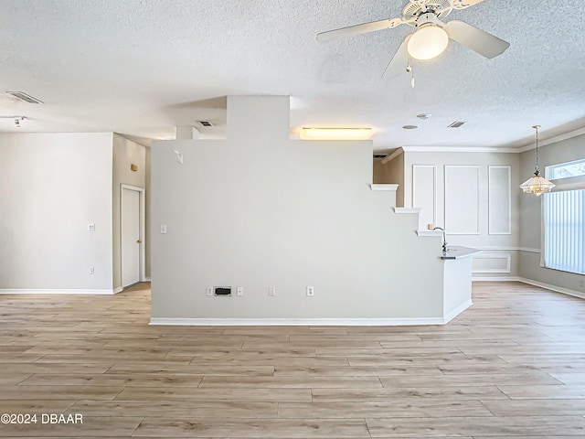 46 Coquina Point Dr, Ormond Beach, FL 32174 - spare room with light hardwood / wood-style flooring, a textured ceiling, and ceiling fan