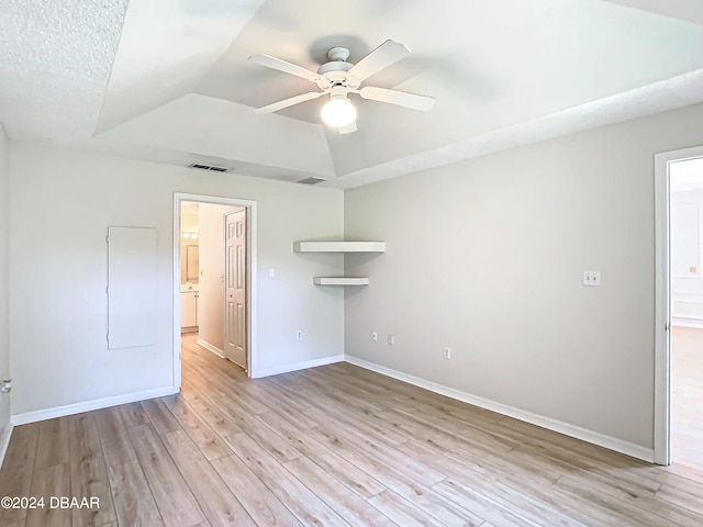 46 Coquina Point Dr, Ormond Beach, FL 32174 - unfurnished room with a textured ceiling, light hardwood / wood-style flooring, lofted ceiling, and ceiling fan
