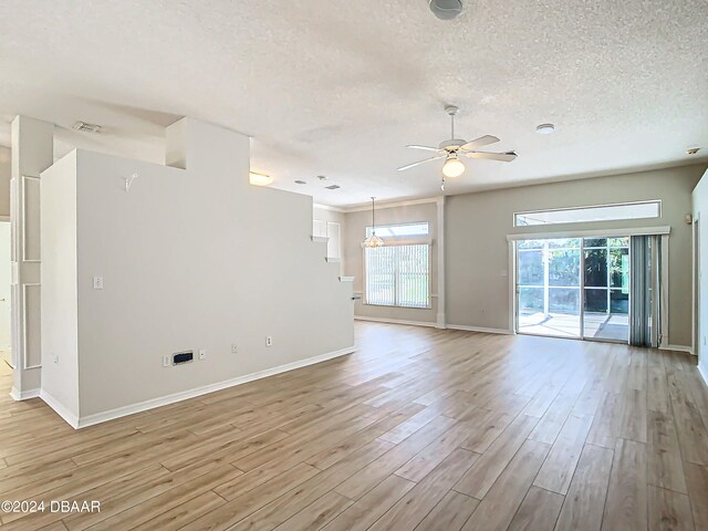 46 Coquina Point Dr, Ormond Beach, FL 32174 - spare room featuring ceiling fan, a textured ceiling, and light hardwood / wood-style flooring