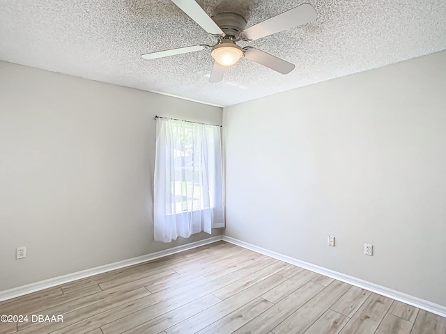 46 Coquina Point Dr, Ormond Beach, FL 32174 - unfurnished room with light hardwood / wood-style floors, ceiling fan, and a textured ceiling