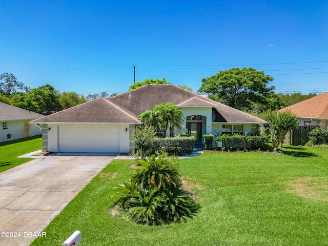 46 Coquina Point Dr, Ormond Beach, FL 32174 - view of front of property featuring a garage and a front yard