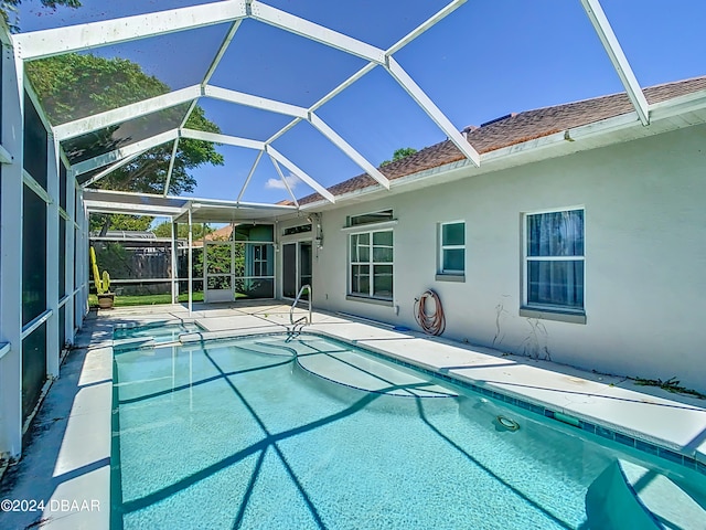 46 Coquina Point Dr, Ormond Beach, FL 32174 - view of swimming pool featuring a patio and glass enclosure