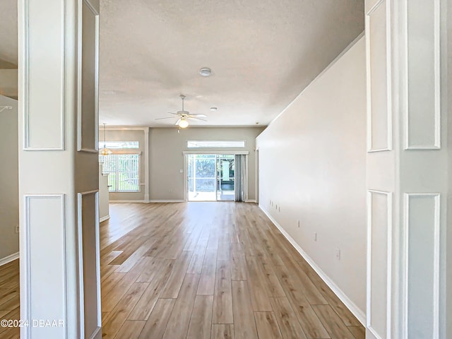 46 Coquina Point Dr, Ormond Beach, FL 32174 - unfurnished living room with light hardwood / wood-style floors and ceiling fan