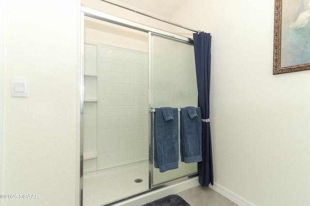 1313 Middle Lake Dr, Ormond Beach, FL 32174 - full bathroom featuring a stall shower and baseboards