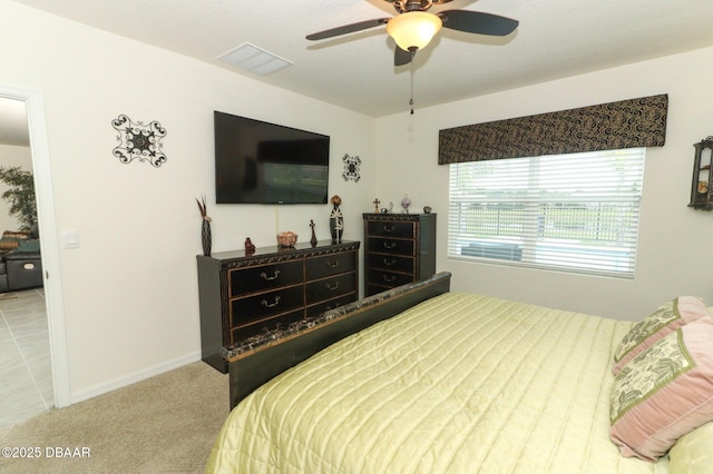 1313 Middle Lake Dr, Ormond Beach, FL 32174 - carpeted bedroom with baseboards and ceiling fan