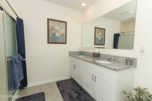 1313 Middle Lake Dr, Ormond Beach, FL 32174 - bathroom featuring double vanity, tile patterned flooring, baseboards, curtained shower, and recessed lighting