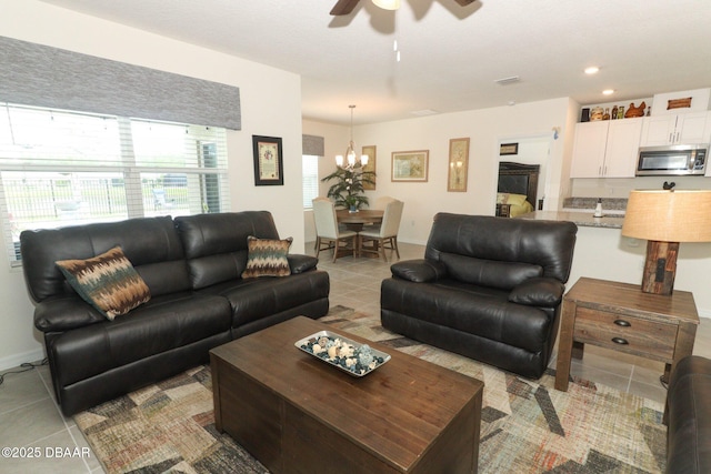 1313 Middle Lake Dr, Ormond Beach, FL 32174 - living area with ceiling fan, light tile patterned floors, a chandelier, and recessed lighting