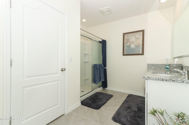 1313 Middle Lake Dr, Ormond Beach, FL 32174 - bathroom with vanity, a shower stall, tile patterned floors, baseboards, and recessed lighting