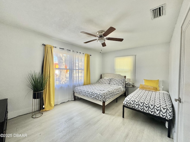326 Ribault Ave, Daytona Beach, FL 32118 - bedroom featuring baseboards, visible vents, wood finished floors, and a ceiling fan