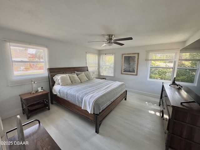 326 Ribault Ave, Daytona Beach, FL 32118 - bedroom featuring baseboards, ceiling fan, and light wood-type flooring
