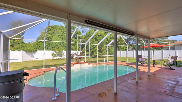 view of pool featuring a lanai, a lawn, and a patio area