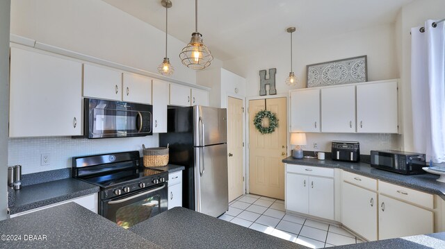 kitchen featuring stainless steel refrigerator, range, and white cabinets